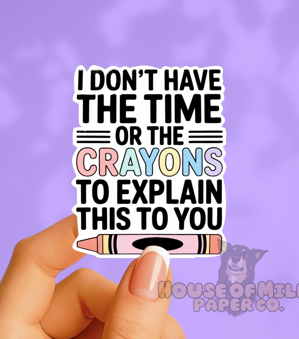 Hand holding a sticker with text and a crayon illustration on a purple background
