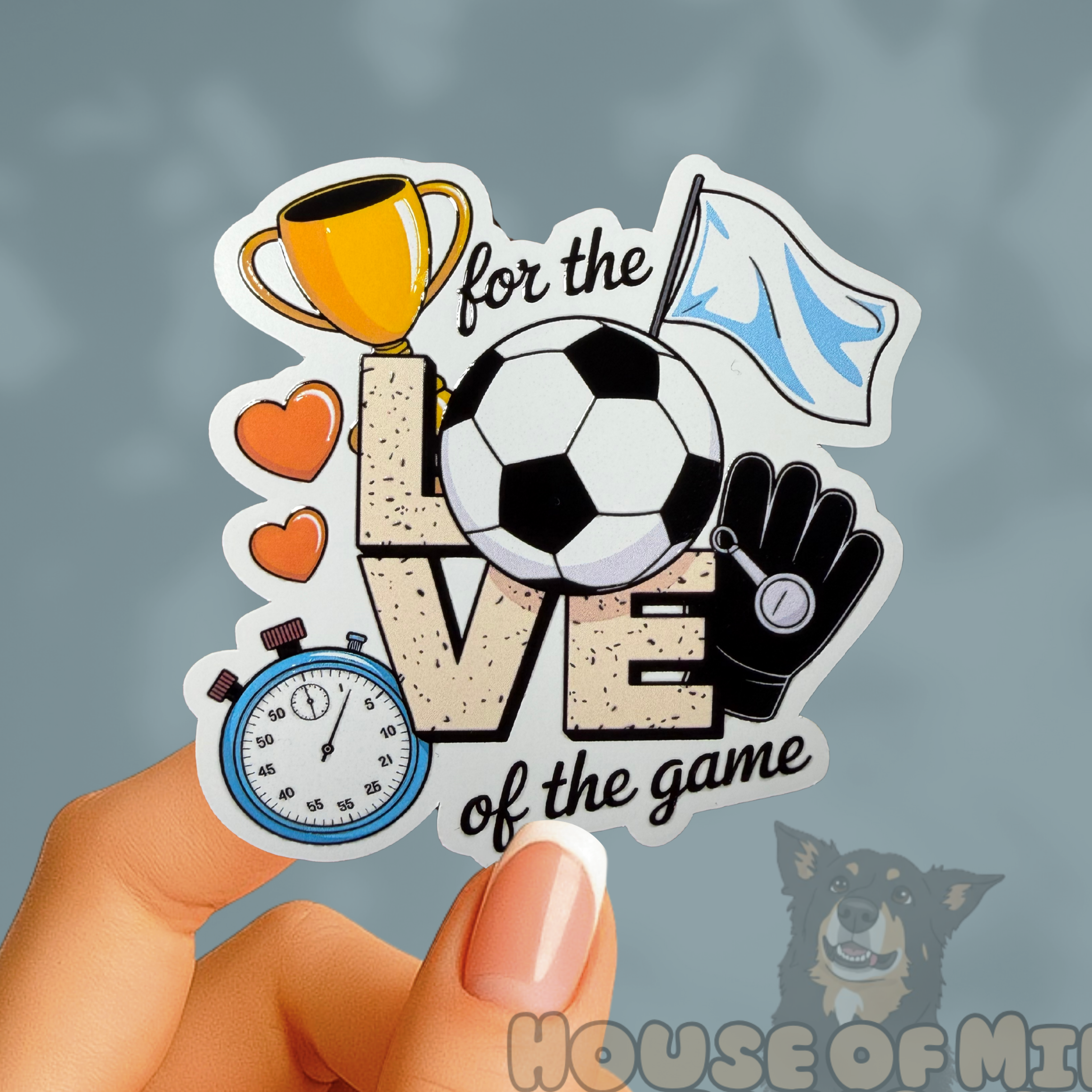 Sticker with soccer-themed design held by a hand against a gray background, with 'House of Milli Paper Co.' branding.