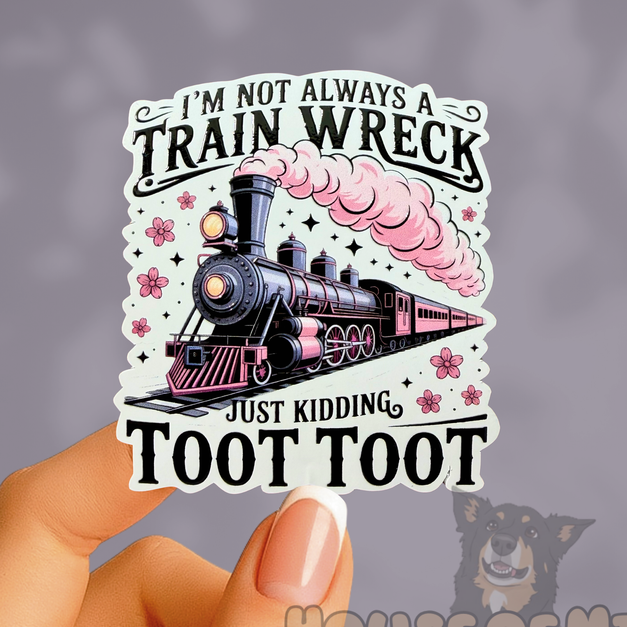 Sticker with a steam train design and humorous text held by a hand against a gray background.