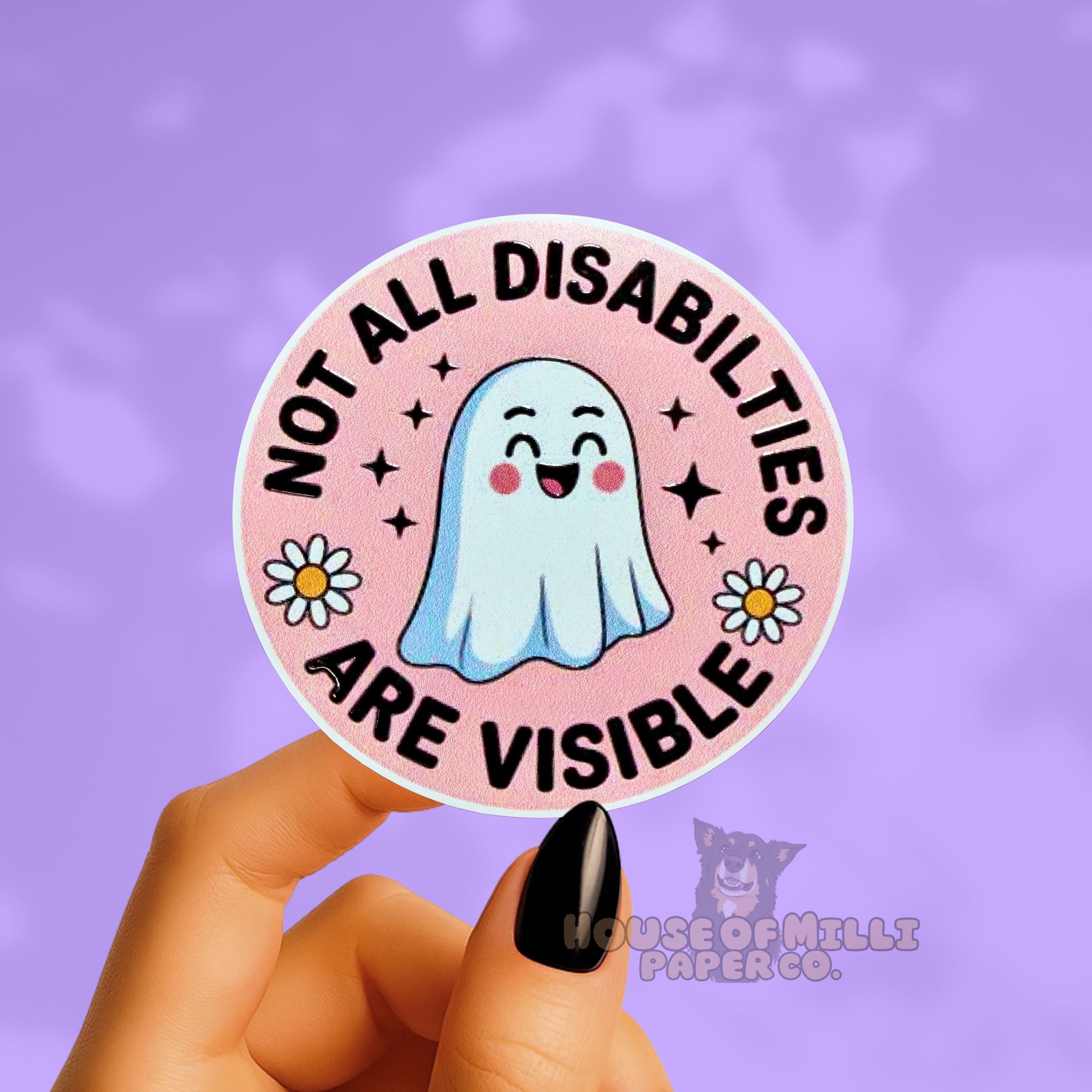 Sticker with a ghost illustration and text 'Not All Disabilities Are Visible' held by a hand on a purple background.