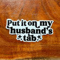 Put It On My Husbands Tab Joke Sticker: Funny Wife Sarcastic Decal