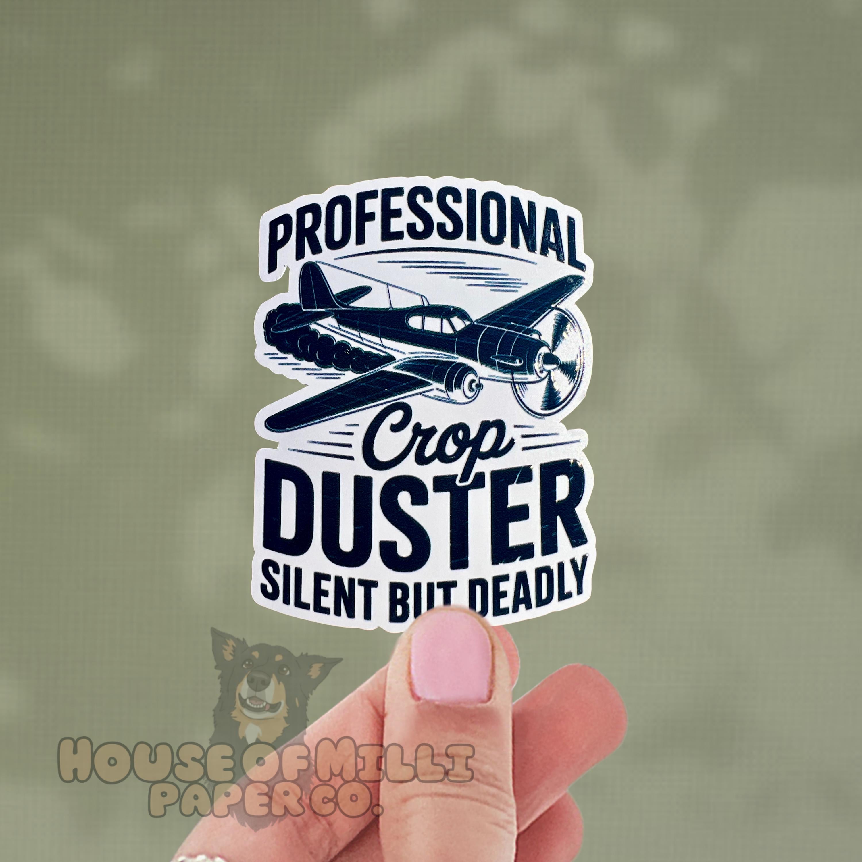 Sticker with airplane design and text 'Professional Crop Duster Silent But Deadly' held by a hand. Fart Joke fathers day