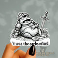 Sticker of a frog in armor with a sword, labeled 't was the carbs m'lord', held by a hand.